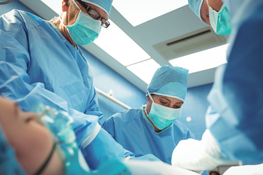 team-of-surgeons-performing-operation-in-operation-theater